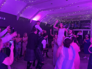a group of people dancing in a room